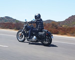 Photo of man on motorcycle with saddlebags installed